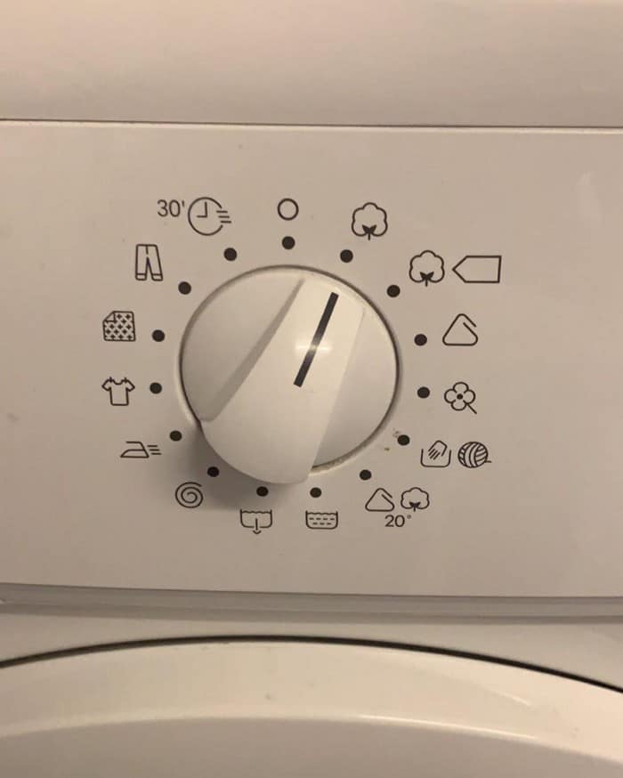 Photograph of a laundry machine dial where all the options are icons