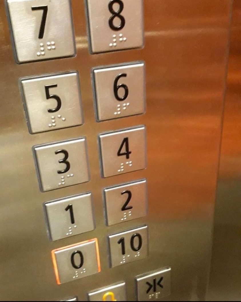 Photograph of an elevator's buttons with floor number 10 next to floor number 0.
